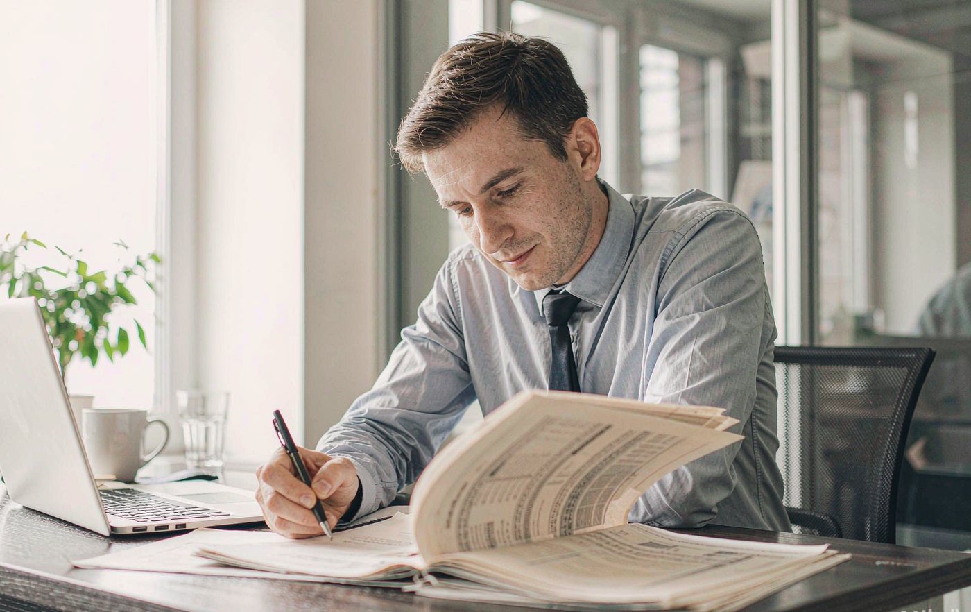 Procurement specialist reviewing supplier quotes and invoices
